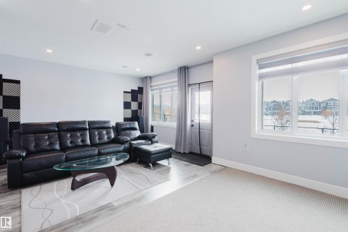 Living room with recessed lighting and light wood finished floors - 16217 32 Avenue, Edmonton, AB - Indoor Photo Showing Living Room