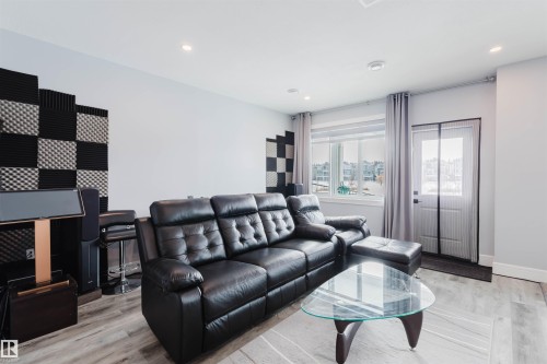 Living area with light wood-style floors and recessed lighting - 16217 32 Avenue, Edmonton, AB - Indoor Photo Showing Living Room