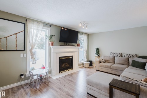 13143 37 Street, Edmonton, AB - Indoor Photo Showing Living Room With Fireplace