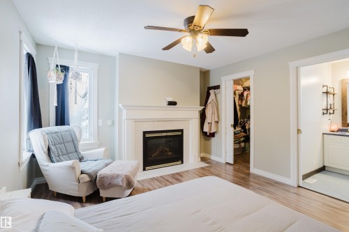 Spacious closet, fireplace, and ensuite bath - 13143 37 Street, Edmonton, AB - Indoor With Fireplace