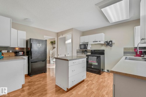 5108 55 Avenue, Leduc, AB - Indoor Photo Showing Kitchen With Double Sink