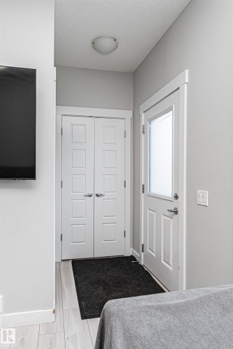 Bedroom featuring a textured ceiling and a closet - 16616 31 Avenue, Edmonton, AB - Indoor