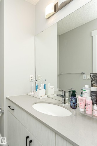 Bathroom featuring vanity and a textured ceiling - 16616 31 Avenue, Edmonton, AB - Indoor Photo Showing Bathroom