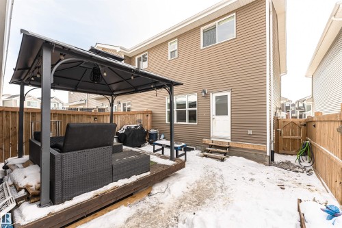 Rear view of house featuring entry steps, a gate, a fenced backyard, and a wooden deck - 16616 31 Avenue, Edmonton, AB - Outdoor With Deck Patio Veranda With Exterior