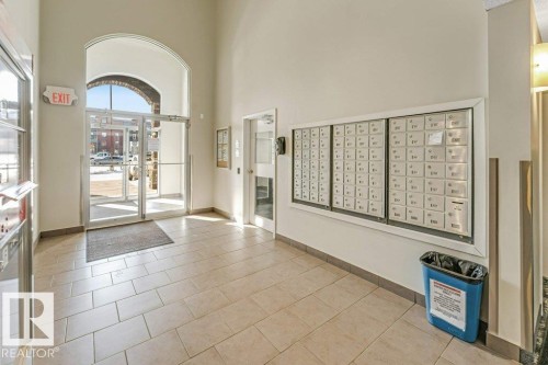 Community lobby with a high ceiling - 101 400 Silver Berry Road, Edmonton, AB - Indoor Photo Showing Other Room