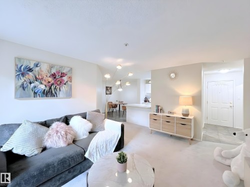 Living room with light carpet - 110 10511 42 Avenue, Edmonton, AB - Indoor