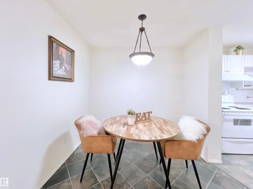 Dining room featuring baseboards - 110 10511 42 Avenue, Edmonton, AB - Indoor
