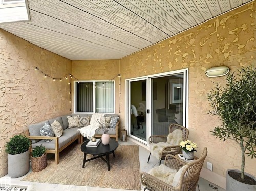 View of patio / terrace featuring outdoor furniture - 110 10511 42 Avenue, Edmonton, AB - Outdoor With Deck Patio Veranda With Exterior