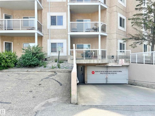 View of apartment building / complex featuring an attached garage - 110 10511 42 Avenue, Edmonton, AB - Outdoor With Balcony