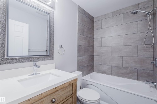 Full bathroom featuring vanity and shower / tub combination - 243 Rhatigan Road E, Edmonton, AB - Indoor Photo Showing Bathroom