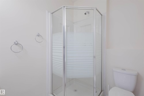 Bathroom with toilet and a shower stall - 243 Rhatigan Road E, Edmonton, AB - Indoor Photo Showing Bathroom