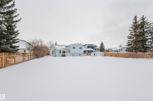 Snowy yard featuring a fenced backyard - 243 Rhatigan Road E, Edmonton, AB - Outdoor