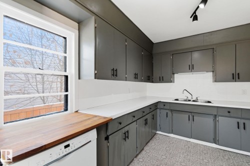 Kitchen with gray cabinetry, dishwasher, wooden counters, and tasteful backsplash - 12225 134 Street, Edmonton, AB - Indoor Photo Showing Kitchen With Double Sink