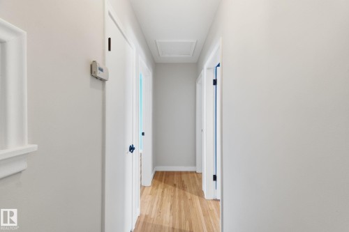 Hallway featuring attic access and light wood-type flooring - 12225 134 Street, Edmonton, AB - Indoor Photo Showing Other Room
