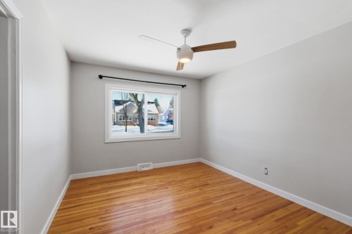 Spare room with light wood-type flooring and a ceiling fan - 12225 134 Street, Edmonton, AB - Indoor Photo Showing Other Room