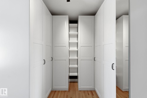 Walk in closet featuring light wood-style flooring - 12225 134 Street, Edmonton, AB - Indoor Photo Showing Other Room