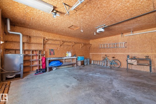 Garage with a workshop area and a garage door opener - 12225 134 Street, Edmonton, AB - Indoor Photo Showing Garage