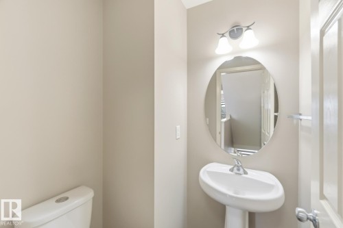 Half bath with toilet and a sink - 16 3751 12 Street, Edmonton, AB - Indoor Photo Showing Bathroom