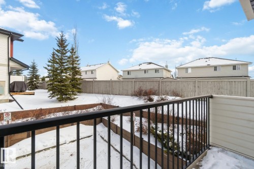 Snow covered back of property featuring a residential view - 16 3751 12 Street, Edmonton, AB - Outdoor With Exterior