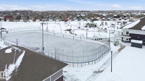 Snowy aerial view featuring a residential view - 71 4029 Orchards Drive, Edmonton, AB - Outdoor