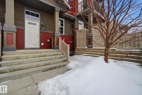 View of snow covered property entrance - 71 4029 Orchards Drive, Edmonton, AB - Outdoor