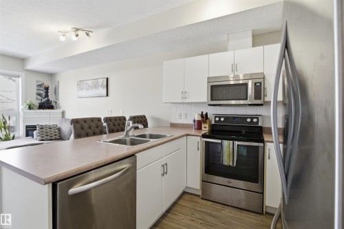 402 11109 84 Avenue, Edmonton, AB - Indoor Photo Showing Kitchen With Stainless Steel Kitchen With Double Sink