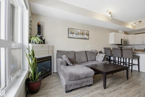 402 11109 84 Avenue, Edmonton, AB - Indoor Photo Showing Living Room With Fireplace