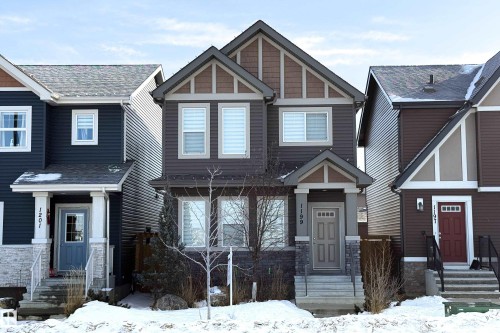 Craftsman house with stone siding and a shingled roof - 1199 Watt Drive, Edmonton, AB - Outdoor With Facade