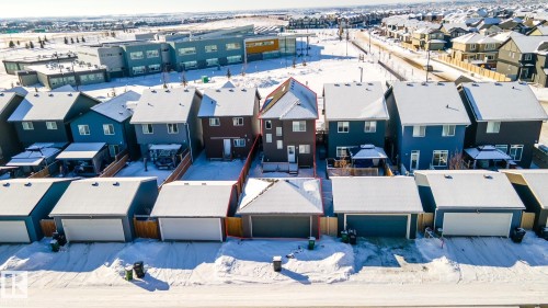 Snowy aerial view with a residential view - 1199 Watt Drive, Edmonton, AB - Outdoor With Facade