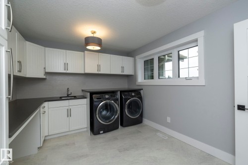 7549 May Common, Edmonton, AB - Indoor Photo Showing Laundry Room