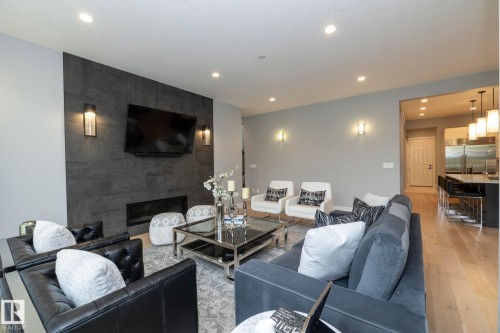 7549 May Common, Edmonton, AB - Indoor Photo Showing Living Room With Fireplace