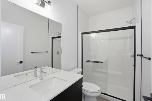 Full bath with vanity and a stall shower - 6949 176A Avenue, Edmonton, AB - Indoor Photo Showing Bathroom