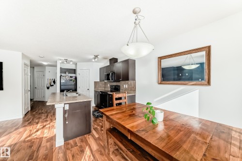 Dining room featuring light wood-style flooring - 17357 8A Avenue, Edmonton, AB 