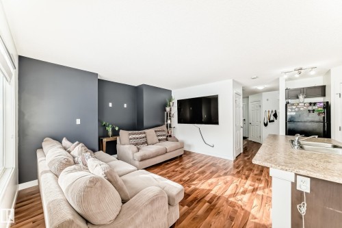 Living area featuring light wood-style flooring - 17357 8A Avenue, Edmonton, AB 