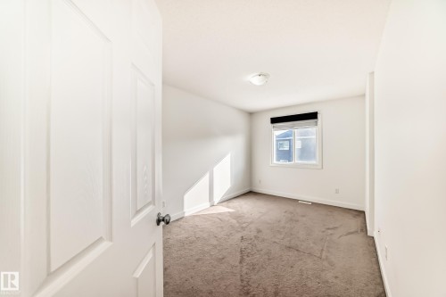 Carpeted spare room with baseboards - 17357 8A Avenue, Edmonton, AB 
