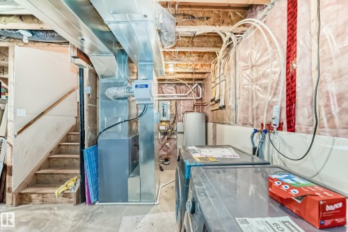 Utilities with washer / dryer, heating unit, water heater, and electric panel - 17357 8A Avenue, Edmonton, AB 