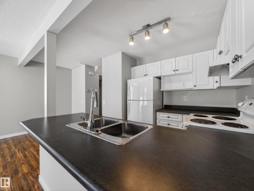138 16823 84 Street, Edmonton, AB - Indoor Photo Showing Kitchen With Double Sink