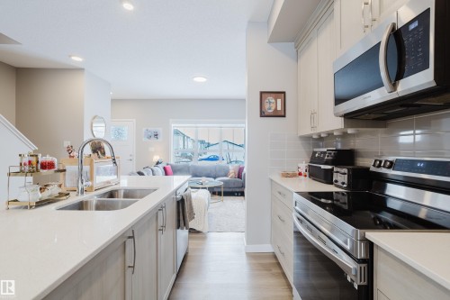 7056 181 Avenue, Edmonton, AB - Indoor Photo Showing Kitchen With Double Sink With Upgraded Kitchen