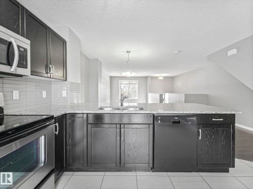 27 1030 Chappelle Boulevard, Edmonton, AB - Indoor Photo Showing Kitchen With Double Sink With Upgraded Kitchen