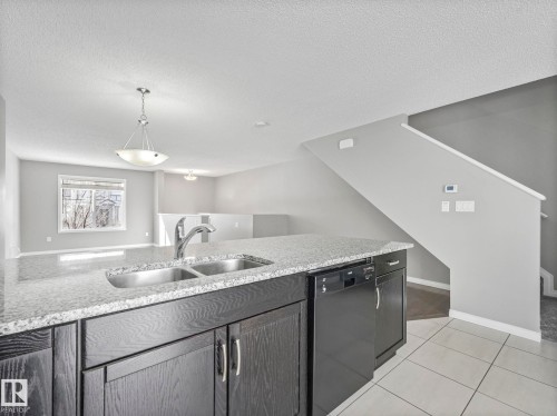 27 1030 Chappelle Boulevard, Edmonton, AB - Indoor Photo Showing Kitchen With Double Sink