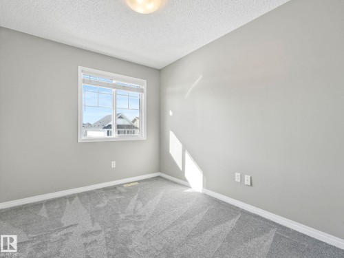 Bedroom 2 - 27 1030 Chappelle Boulevard, Edmonton, AB - Indoor Photo Showing Other Room
