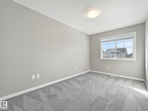 Bedroom 3 - 27 1030 Chappelle Boulevard, Edmonton, AB - Indoor Photo Showing Other Room