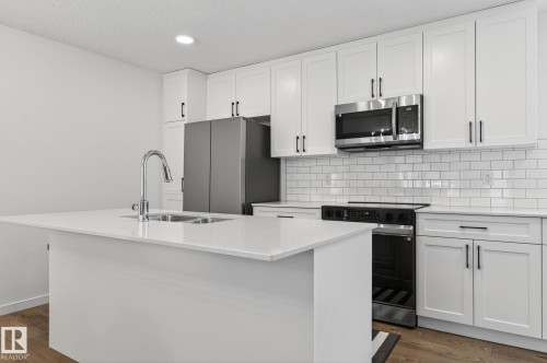 7 50 Mclaughlin Drive, Spruce Grove, AB - Indoor Photo Showing Kitchen With Double Sink With Upgraded Kitchen