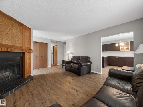 5116 37 Avenue, Edmonton, AB - Indoor Photo Showing Living Room With Fireplace