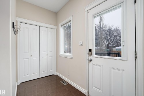 Entryway with baseboards and tile patterned flooring - 10623 75 Avenue, Edmonton, AB - Indoor Photo Showing Other Room