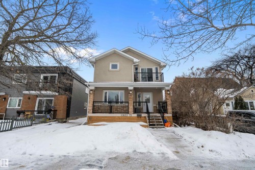 View of front of house with stucco siding, a balcony, and a porch - 10623 75 Avenue, Edmonton, AB - Outdoor With Facade