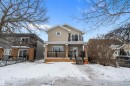 View of front of house with stucco siding, a balcony, and a porch - 10623 75 Avenue, Edmonton, AB  - Outdoor With Facade 
