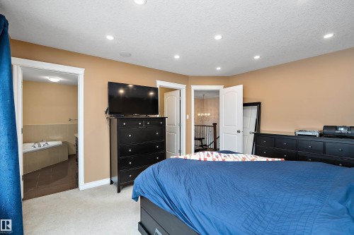 Bedroom featuring light carpet, a textured ceiling, and recessed lighting - 10623 75 Avenue, Edmonton, AB - Indoor Photo Showing Bedroom