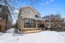 View of front of property featuring stucco siding, a balcony, and covered porch - 10623 75 Avenue, Edmonton, AB  - Outdoor 