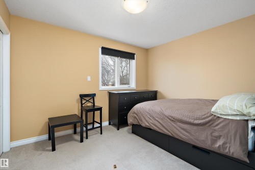 Bedroom featuring carpet floors and a textured ceiling - 10623 75 Avenue, Edmonton, AB - Indoor Photo Showing Bedroom